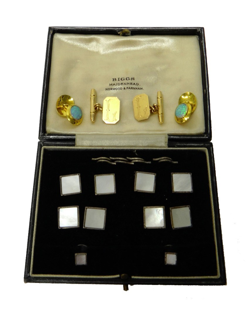 Appraisal: A pair of opal set oval dress cufflinks a pair