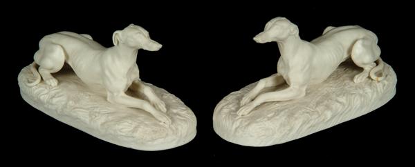 Appraisal: A pair of English parian models of recumbent greyhounds probably