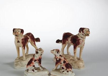 Appraisal: TWO PAIR OF STAFFORDSHIRE FIGURES OF IRON-RED SPOTTED DOGS NINETEENTH