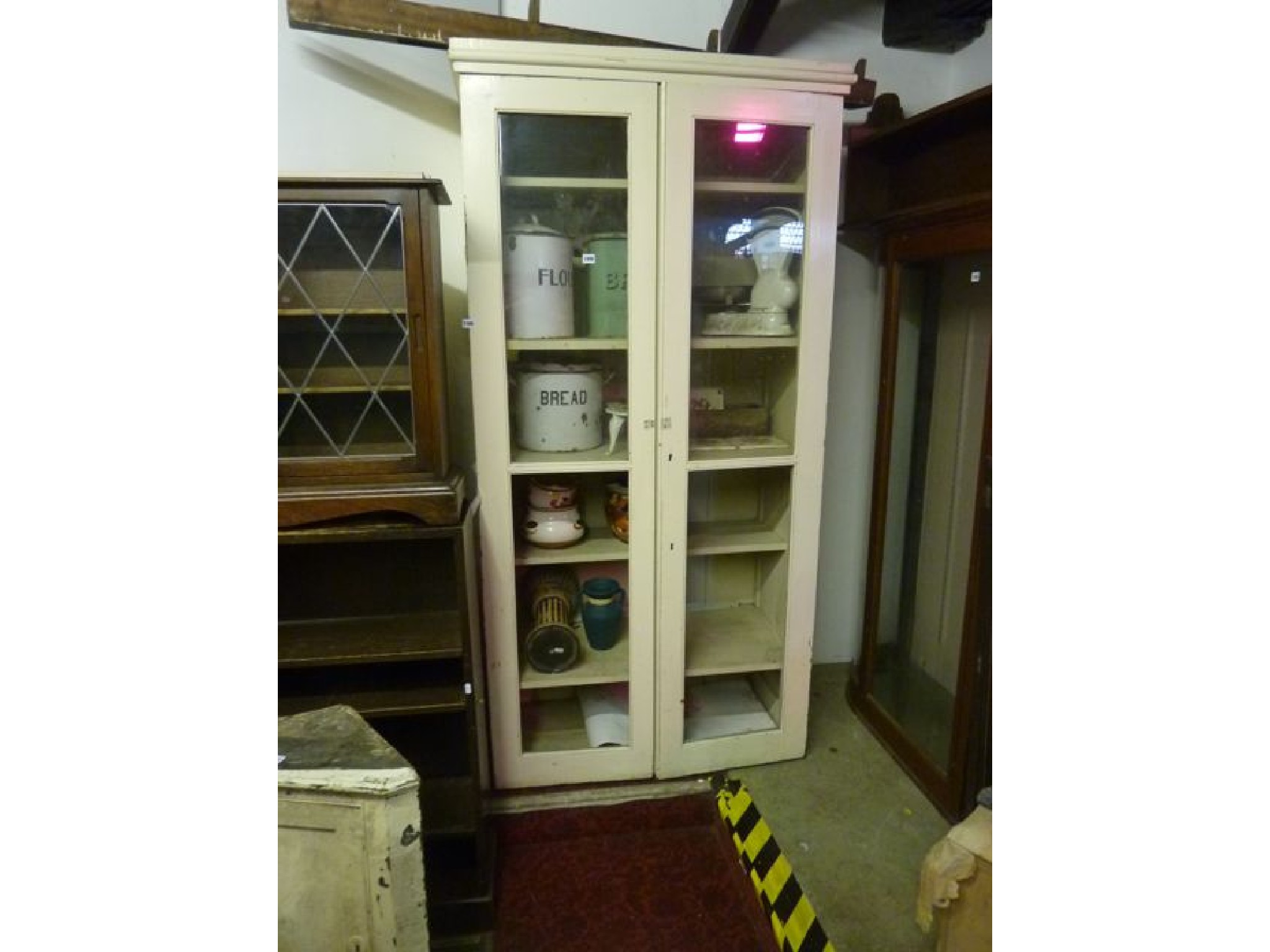 Appraisal: A th century painted pine and freestanding kitchen cabinet enclosed