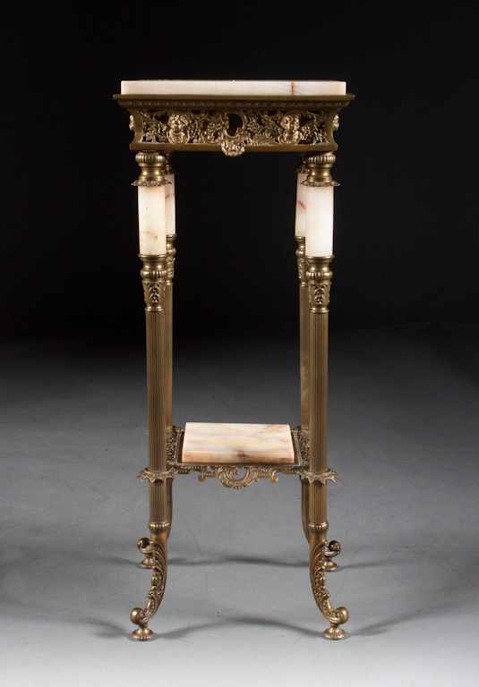 Appraisal: Victorian cast gilt-brass and onyx two-tier plant stand late th