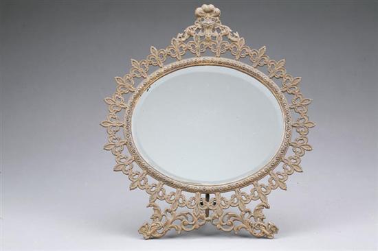 Appraisal: FRAMED DRESSER MIRROR Brass frame with a ring motif inside