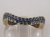 Appraisal: A stylized carat white gold sapphire eternity ring by de