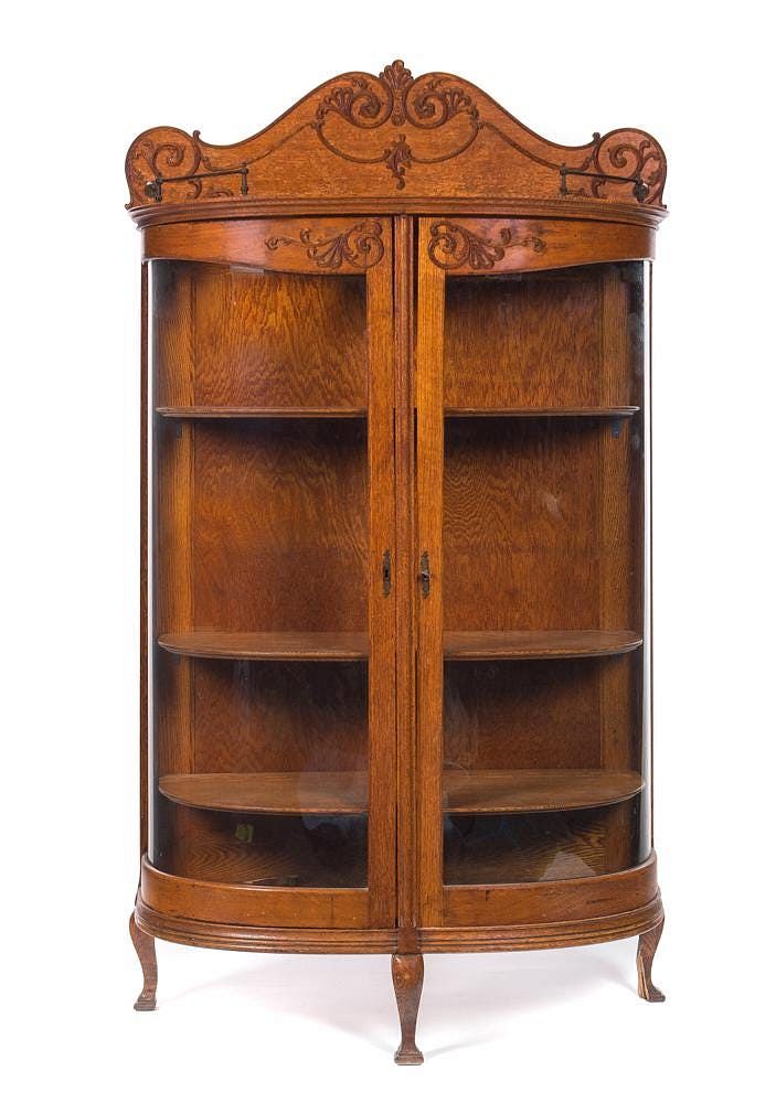 Appraisal: Oak Curved Glass Curio Cabinet Oak Curved Glass Curio Cabinet