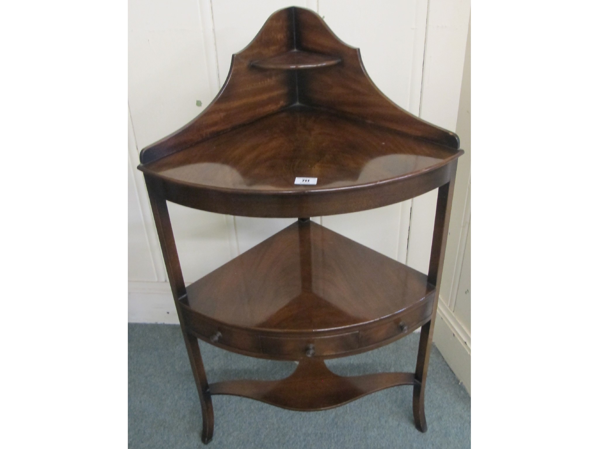 Appraisal: A Victorian mahogany corner washstand