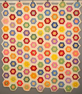 Appraisal: Grandmother's Flower Garden patchwork quilt A circa Grandmother's Flower Garden