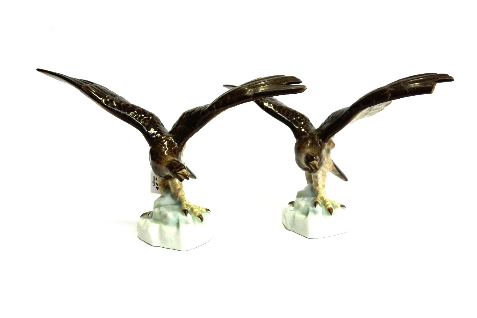 Appraisal: A pair of Herend porcelain birds of prey each modelled