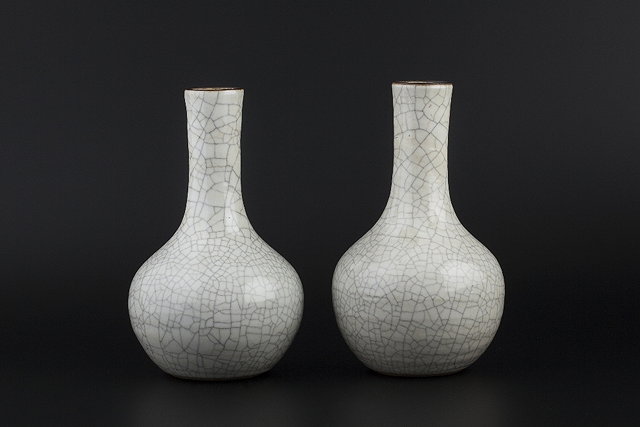 Appraisal: Two similar Chinese bottle vases th Centurydecorated with a greyish