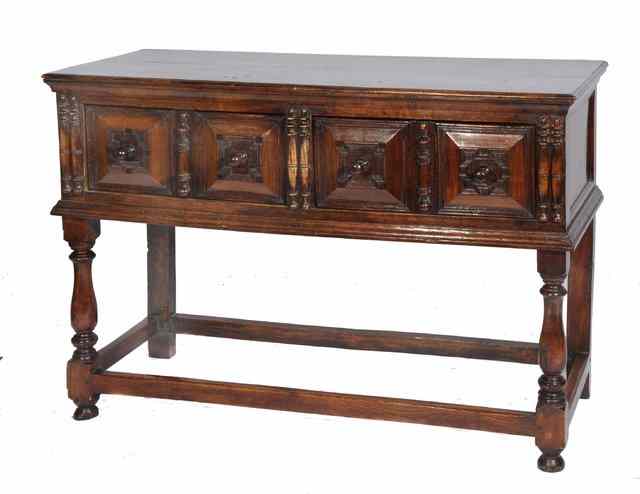 Appraisal: A CHARLES II STYLE OAK DRESSER fitted two drawers with