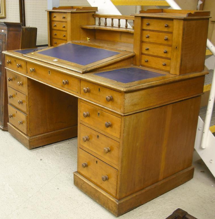 Appraisal: Victorian Dickens style golden oak pedestal desk the raised galleried