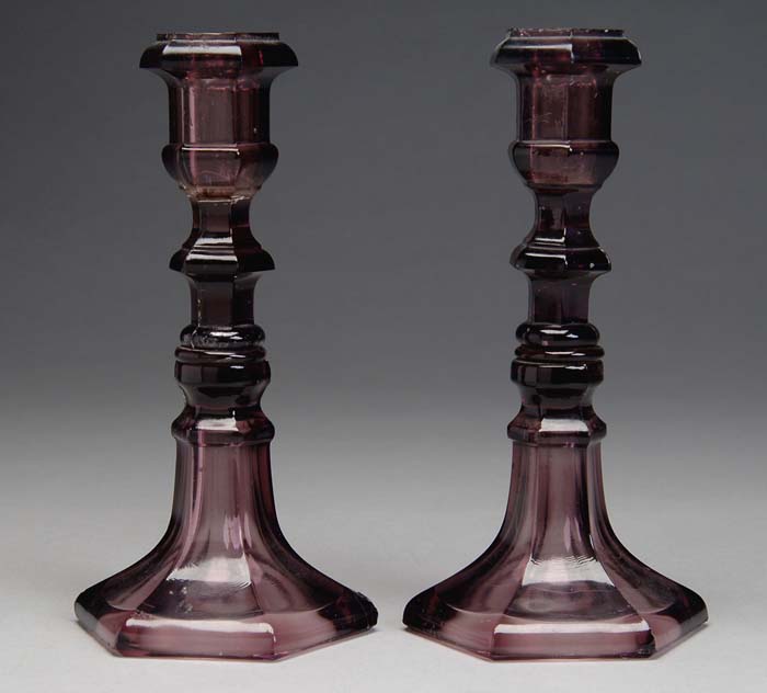 Appraisal: PAIR OF AMETHYST SANDWICH CANDLESTICKS Light amethyst sticks have six