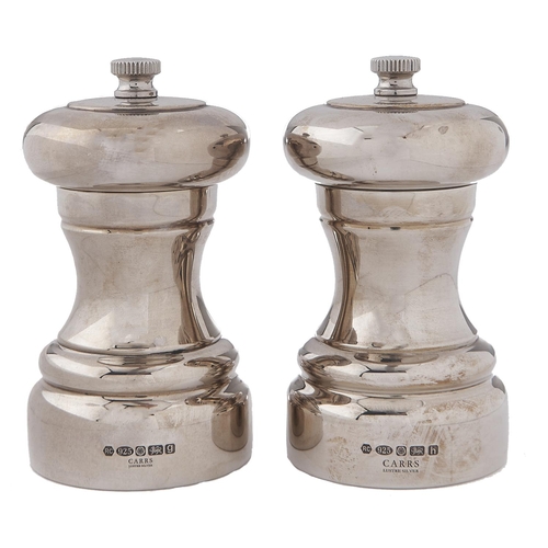 Appraisal: Two Elizabeth II silver pepper mills cm h by Carrs