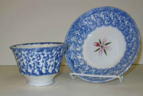 Appraisal: ENGLISH SPATTERWARE Blue spatter handless cup and saucer decorated with