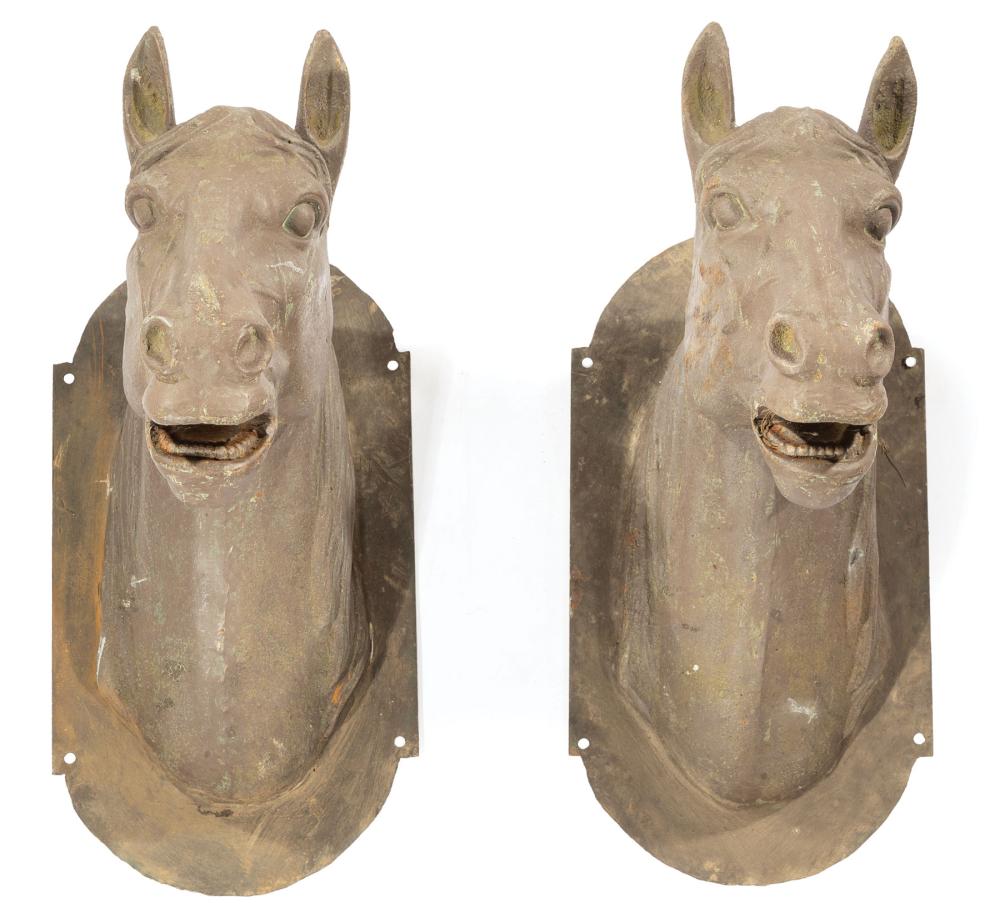 Appraisal: Pair of Cast Iron Architectural Horse Heads mounted on lobed