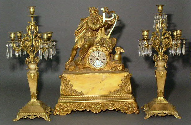 Appraisal: French bronze and marble mantel clock c with pair of