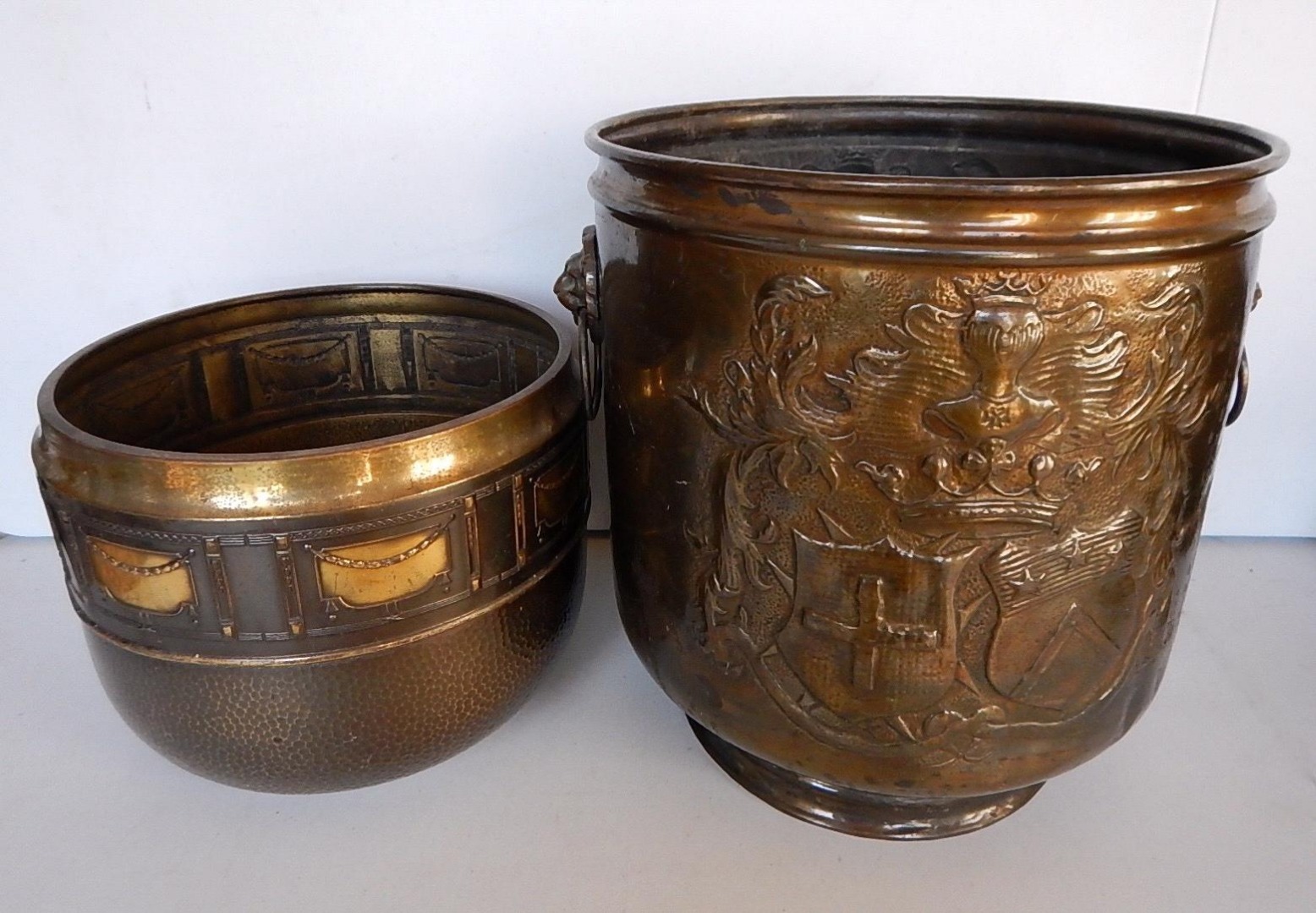 Appraisal: A lacquered embossed brass coal bucket and a brass jardiniere