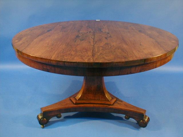 Appraisal: A Regency rosewood circular breakfast table with tilt top tri-part