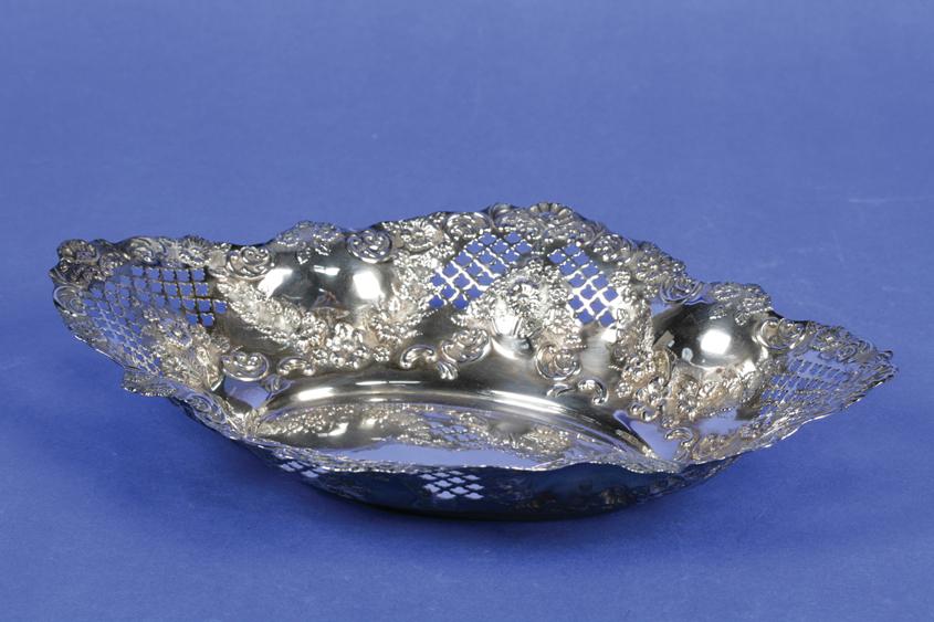 Appraisal: A LATE VICTORIAN FRUIT DISH of shaped oval form the