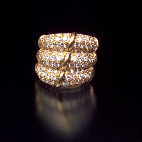 Appraisal: DIAMOND Band ring in k yellow gold Pav -set lobes