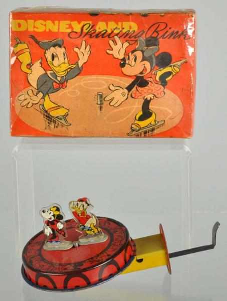 Appraisal: Mettoy Disney Minnie Donald Skating Rink Toy Description English Scarce