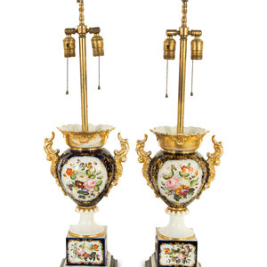 Appraisal: A Pair of French Porcelain Urns Mounted as Lamps th