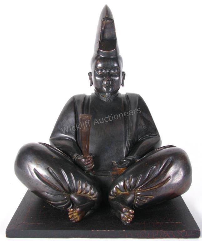 Appraisal: Bronze Seated Monk Figure depicting a seated monk holding a