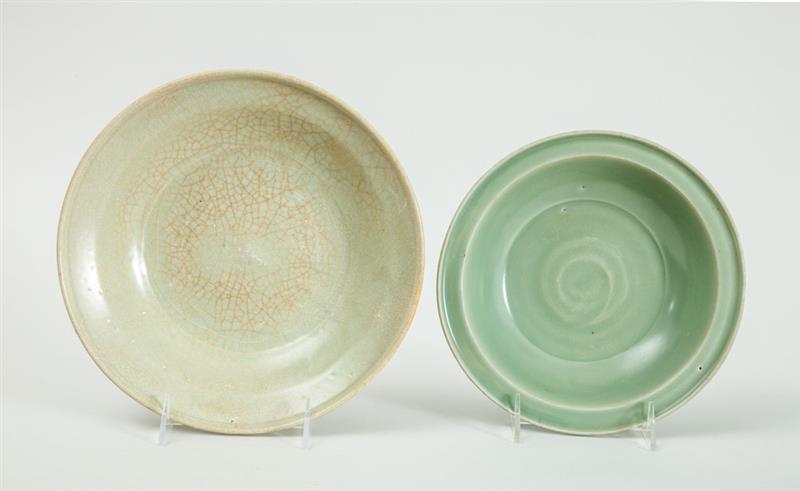 Appraisal: TWO CHINESE CELADON-GLAZED DEEP DISHES The one with slightly raised