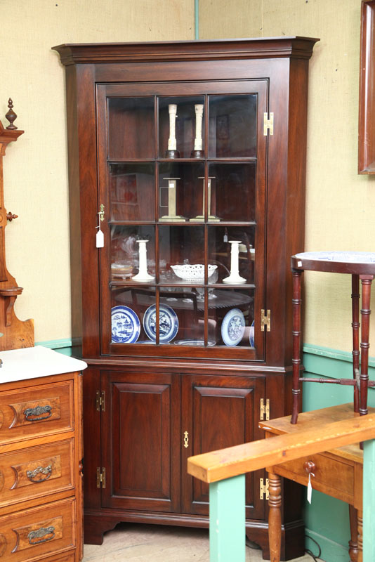 Appraisal: HENKEL-HARRIS CORNER CUPBOARD Mahogany having a twelve pane glazed door