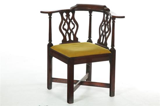 Appraisal: CHIPPENDALE-STYLE CORNER OR ROUNDABOUT CHAIR Late th-early th century mahogany