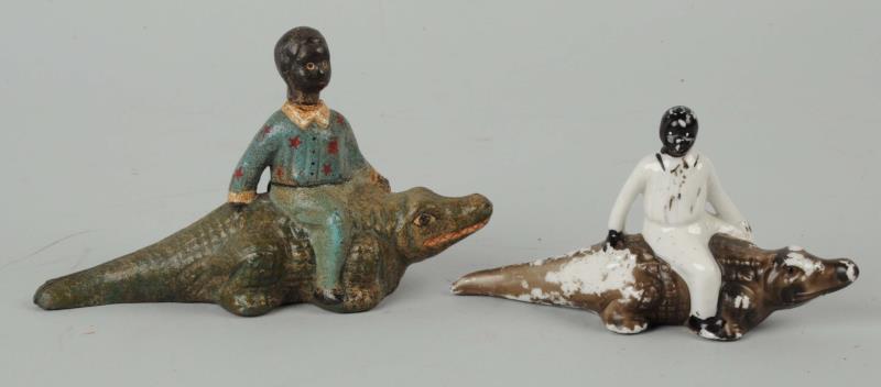 Appraisal: Lot Of Black Americana Figures On Alligators One is cast