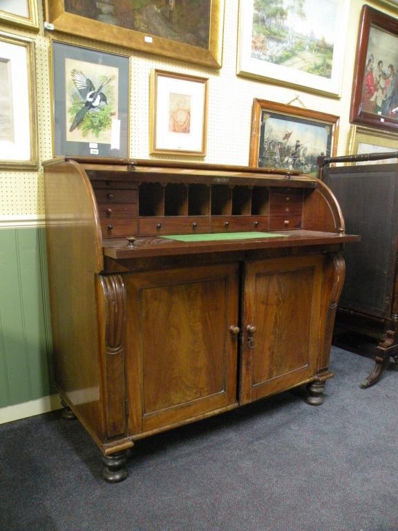 Appraisal: A mid thC mahogany and rosewood cross banded cylinder bureau