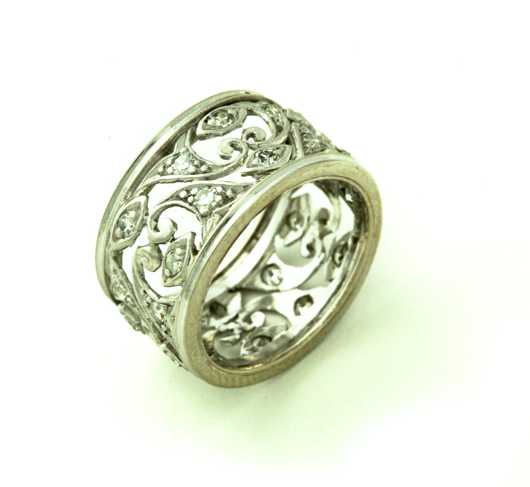 Appraisal: DIAMOND RING Twentieth century White gold wide band with openwork