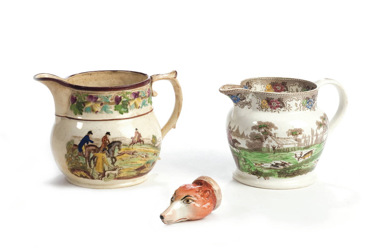 Appraisal: TWO ENGLISH ENAMEL-DECORATED BROWN TRANSFER-PRINTED HUNT JUGS AND A FOX