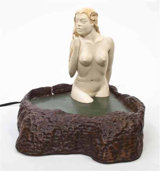 Appraisal: A Carved Ivory Figure of a Bathing Lady the figure