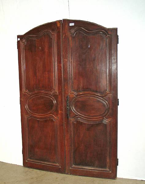 Appraisal: An assembled lot of wooden doors including a pair of