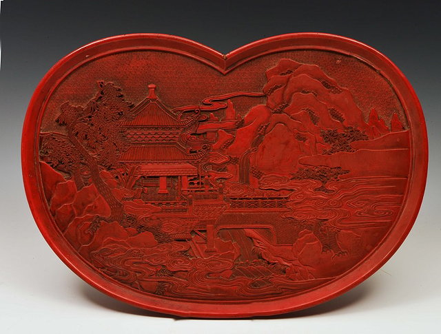 Appraisal: A CHINESE CINNABAR SHAPED OVAL TRAY with landscape mountain and