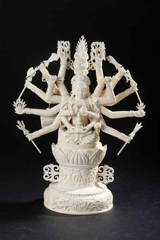 Appraisal: CHINESE IVORY FIGURE OF MULTI-ARM GODDESS Seated on a lotus