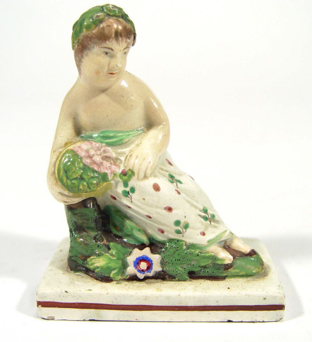 Appraisal: Early th Century Staffordshire figure of a woman clutching a