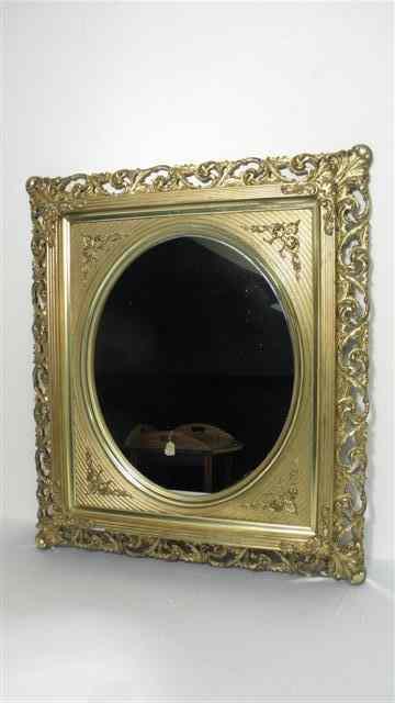 Appraisal: Gold gilt wall mirror with ornate carved wood frame Circular