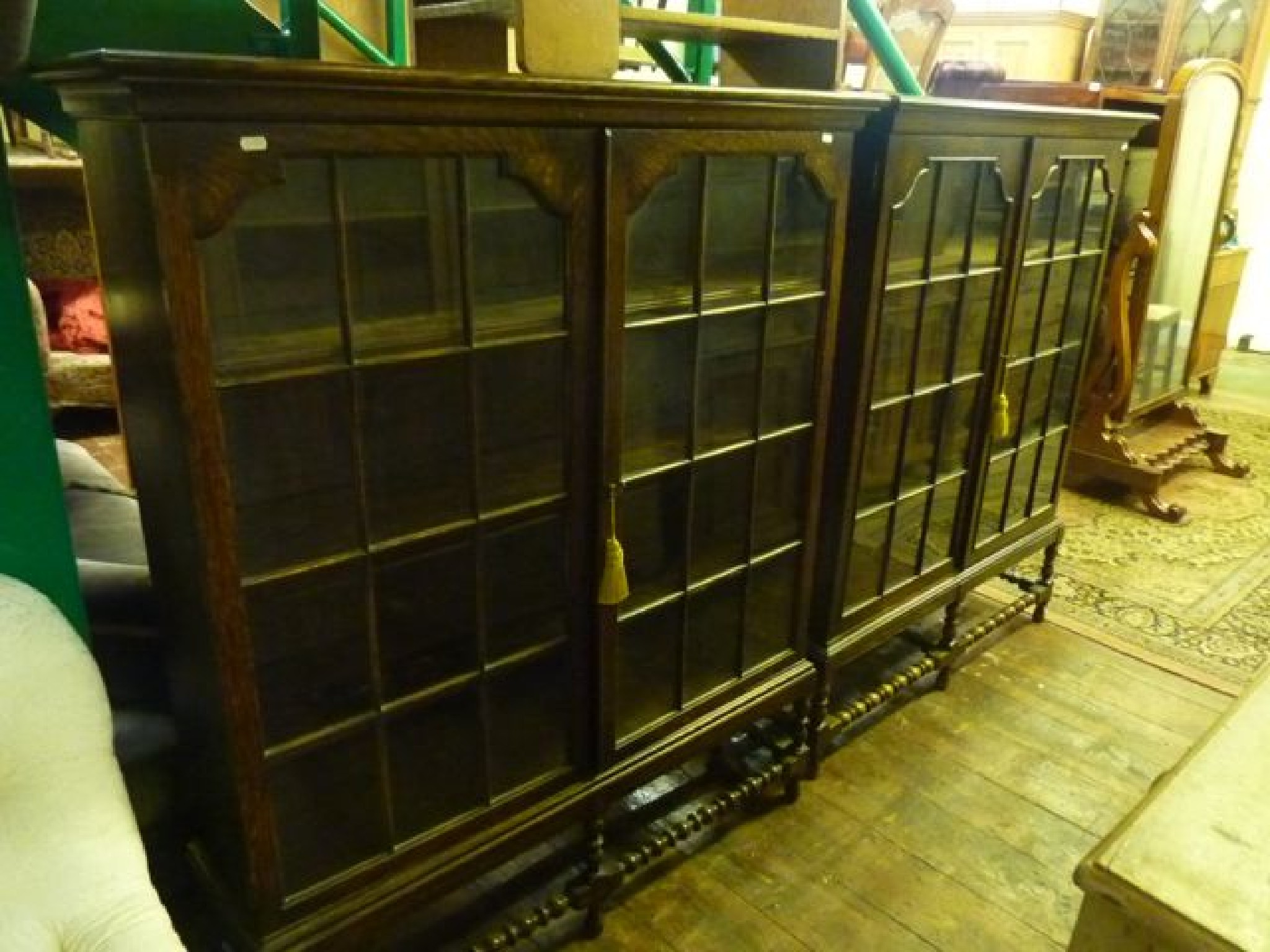 Appraisal: A pair of s oak bookcases each enclosed by a