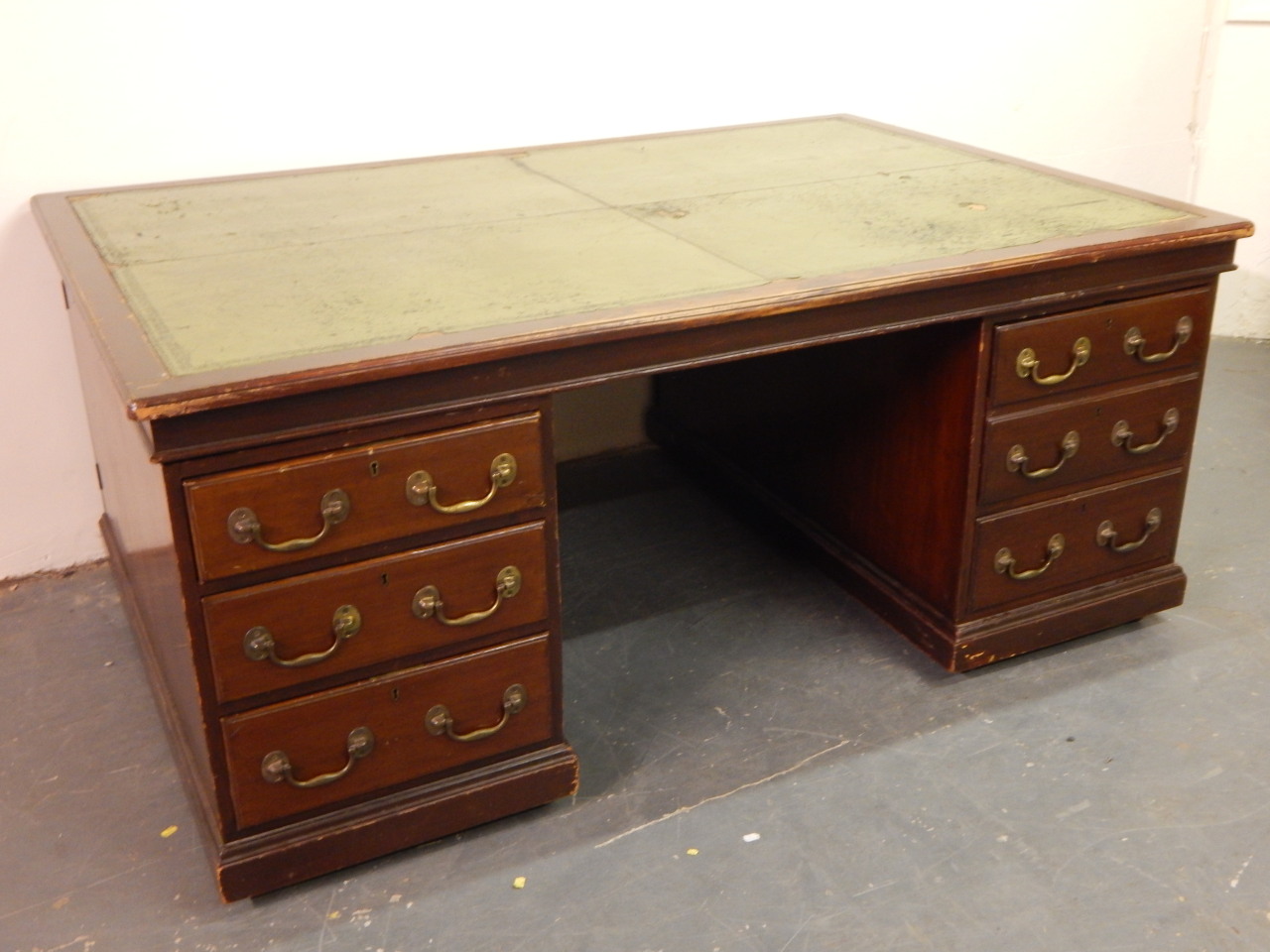 Appraisal: An early thC mahogany partner's desk the top with a