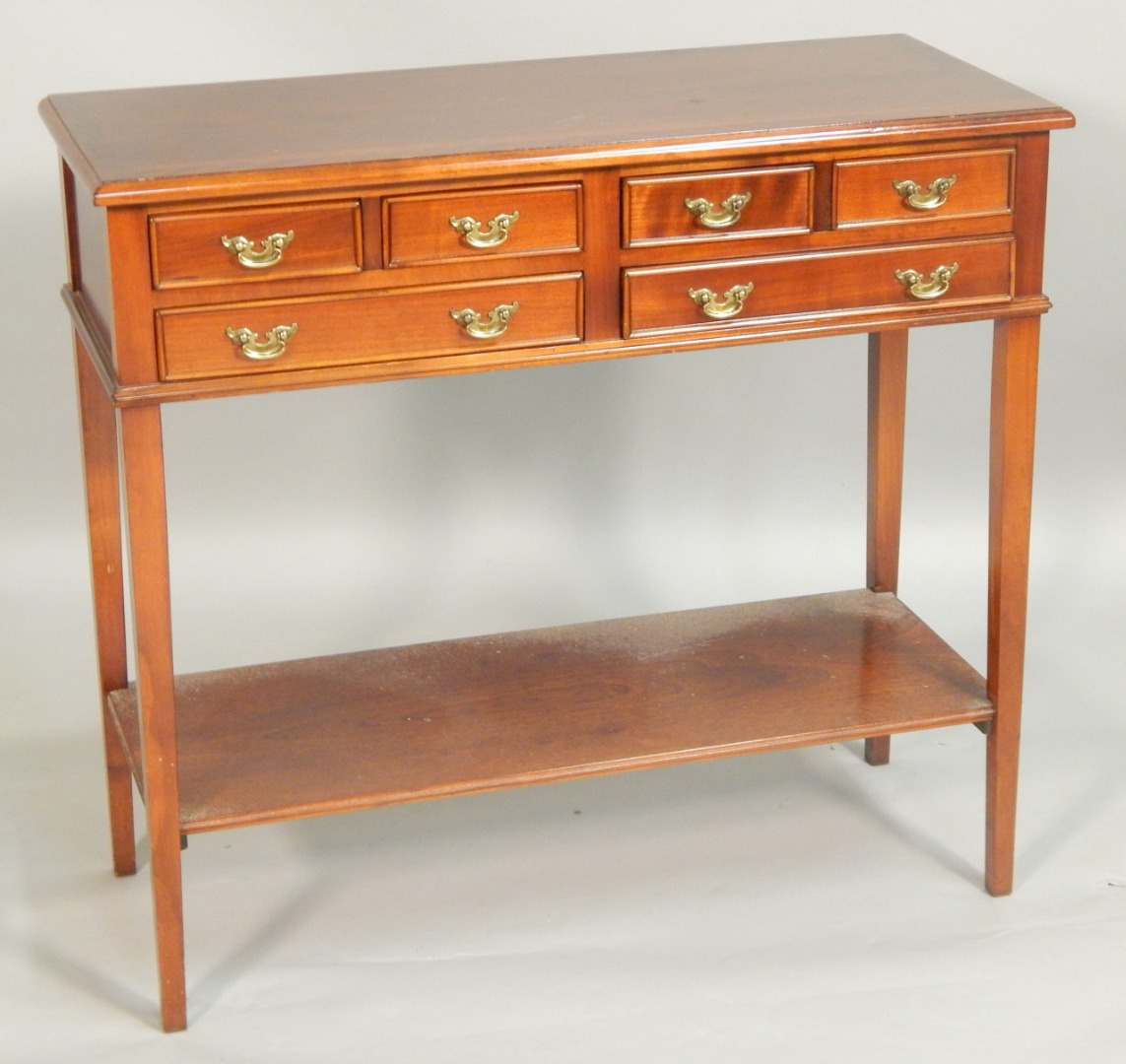 Appraisal: A reproduction mahogany and chequer banded side table with an