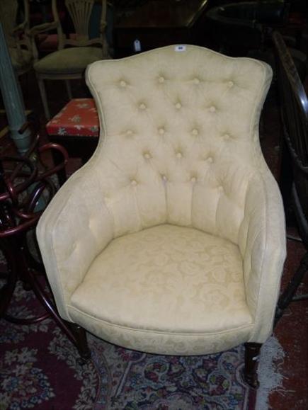 Appraisal: A th century button upholstered armchair on turned supports