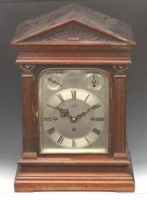 Appraisal: A MAHOGANY TABLE CLOCK the silvered dial with Roman chapter