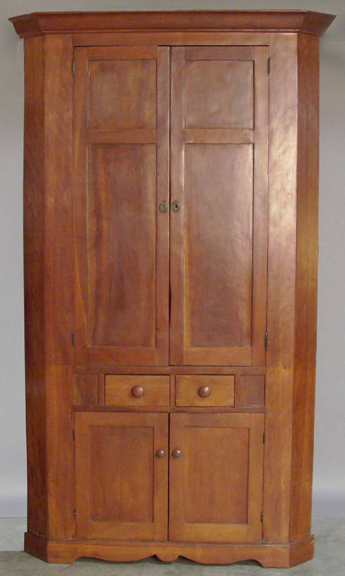 Appraisal: Pennsylvania cherry one piece corner cupboard th c x