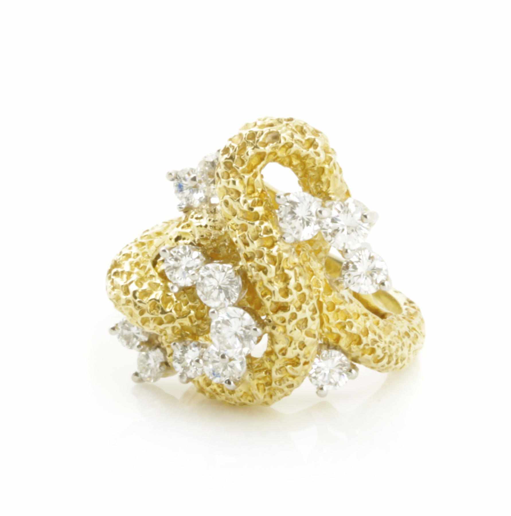 Appraisal: A diamond and gold textured ring estimated total diamond weight