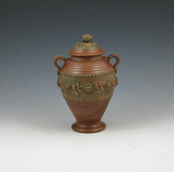 Appraisal: Weller Clarmont urn with lid Unmarked Small chip to flower