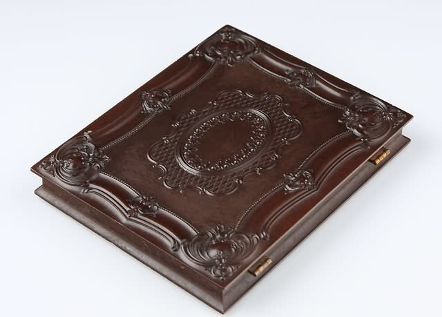 Appraisal: Half plate union case Geometric Scroll Krainik- Case contains ambrotype