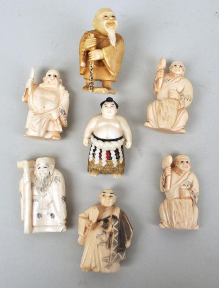 Appraisal: Seven Japanese Carved Figural Netsuke comprising a polychrome sumo wrestler