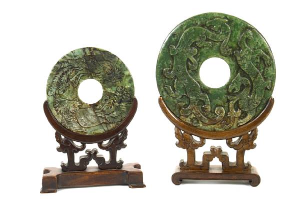 Appraisal: Two archistic carved spinach jade bi discs diameter of larger